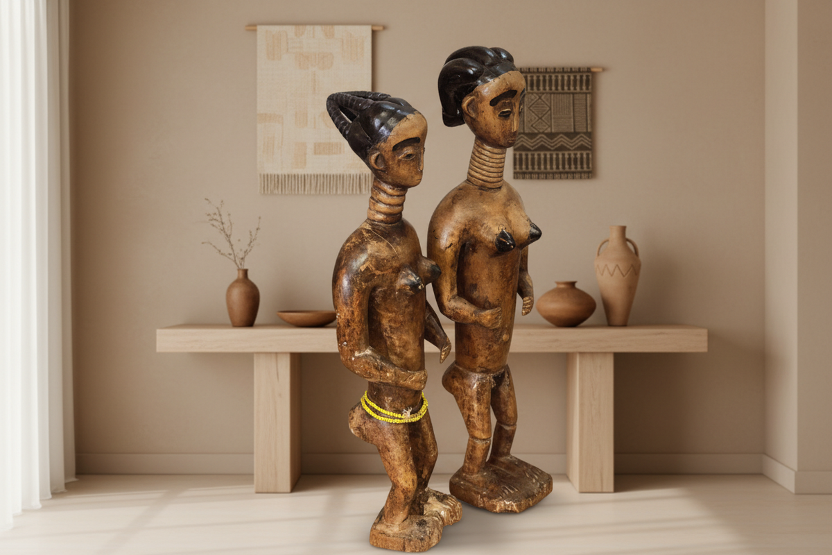 Pair of 20th-century Ashanti wooden figurines from Ghana displayed together in a curated interior